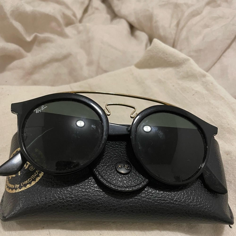 Black ray ban sunglasses with gold bridge